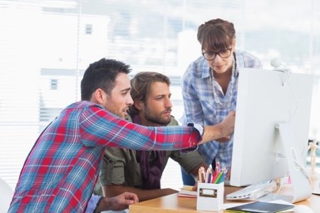 Team of designers working together on a computer-241295-edited